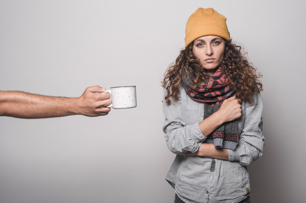 person giving coffee sick woman against gray background 23 2147889463