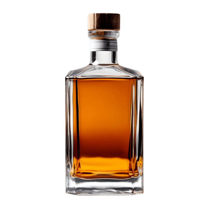 A clear glass bottle filled with amber-colored liquor, sealed with a wooden cap, is centered on a plain white background.